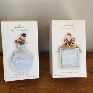 2 Vintage 2009 Hallmark Ornaments. Santa’s magic touch & wonder of Snow.